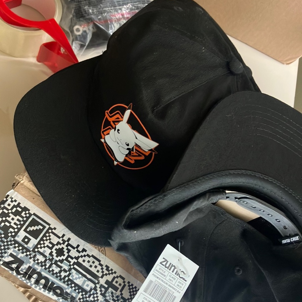 Zumiez Black Snapback Hat with Cartoon Logo